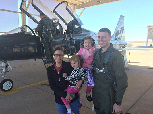 Captain Sam Oldham with his wife Jill and two daughters - Erin and Lilly